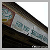 Slogan on top of entrance into the building "We must care about the world"